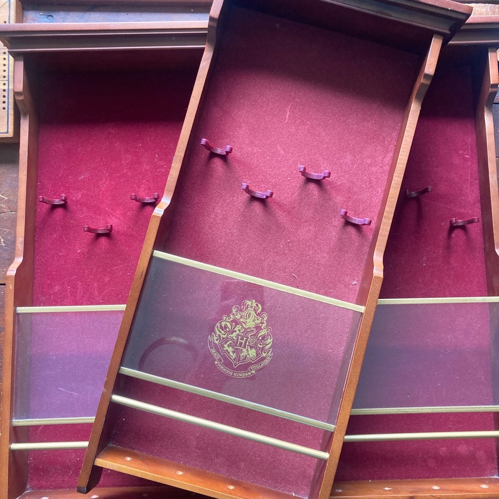 Two Harry Potter wand display cases
